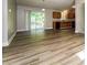 Bright living space featuring modern flooring and sliding door access to outdoor deck at 1034 Sandy Ridge Rd, Mcdonough, GA 30252