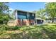 This backyard features a lawn and the back of the house at 10664 Sandpiper Rd, Jonesboro, GA 30238