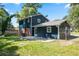 This backyard features a lawn and the back of the house at 10664 Sandpiper Rd, Jonesboro, GA 30238