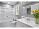 This bathroom features a tub with a shower, and a large vanity at 10664 Sandpiper Rd, Jonesboro, GA 30238