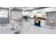 Bright kitchen with white cabinetry, granite counters, and a center island with seating at 10664 Sandpiper Rd, Jonesboro, GA 30238