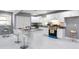 Bright kitchen with white cabinetry, granite countertops, island with seating, and stainless steel appliances at 10664 Sandpiper Rd, Jonesboro, GA 30238