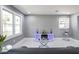 Bright living room with a modern touch featuring marble floors, sleek furniture, and large windows at 10664 Sandpiper Rd, Jonesboro, GA 30238