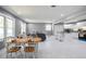 Spacious open-concept living and dining area featuring recessed lighting, marble-look flooring, and a kitchen bar at 10664 Sandpiper Rd, Jonesboro, GA 30238