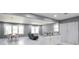 Spacious open floor plan featuring a dining area, living room with modern furniture, and kitchen with center island at 10664 Sandpiper Rd, Jonesboro, GA 30238