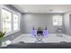 Bright and open living room with modern decor, large windows, marble-look flooring, and recessed lighting at 10664 Sandpiper Rd, Jonesboro, GA 30238