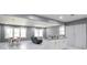 Spacious living area featuring marble floors, dining space, a modern kitchen island, and ample natural light at 10664 Sandpiper Rd, Jonesboro, GA 30238