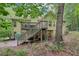 Home's backyard features a spacious deck that enhances outdoor living and entertainment at 2297 Herring Woods Way, Grayson, GA 30017