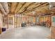 Unfinished basement space with exposed insulation and framing offering customization potential at 2297 Herring Woods Way, Grayson, GA 30017