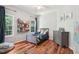 Inviting bedroom featuring hardwood floors, dresser, and large windows at 2297 Herring Woods Way, Grayson, GA 30017