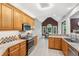 Spacious kitchen with stainless appliances, breakfast bar, tile backsplash, and an adjacent dining space with natural light at 2297 Herring Woods Way, Grayson, GA 30017