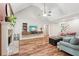 Spacious living room featuring fireplace, wood flooring, high ceilings, and a staircase visible in the background at 2297 Herring Woods Way, Grayson, GA 30017