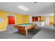Basement with recessed lighting, with a billiards table and wet bar for entertaining at 2641 Loch Way, Snellville, GA 30039