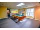 Finished basement featuring a pool table, neutral carpet, and natural light from two large windows at 2641 Loch Way, Snellville, GA 30039