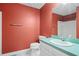 A cozy bathroom features a single sink, ample mirror, and a shower and tub combination at 2641 Loch Way, Snellville, GA 30039