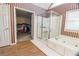 Main bathroom with double sinks, a soaking tub, walk in shower and a walk in closet at 2641 Loch Way, Snellville, GA 30039