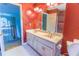 Stylish bathroom featuring a double vanity and a large mirror at 2641 Loch Way, Snellville, GA 30039