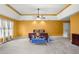 Large bedroom with natural light from windows with curtains and a ceiling fan at 2641 Loch Way, Snellville, GA 30039