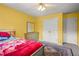 Bedroom with a ceiling fan, gray dresser and a silver colored bed frame at 2641 Loch Way, Snellville, GA 30039