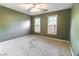 Bedroom features carpet and windows with shutters at 2641 Loch Way, Snellville, GA 30039