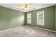Bedroom featuring a ceiling fan, and natural light from two windows at 2641 Loch Way, Snellville, GA 30039