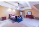 Spacious bedroom featuring a tray ceiling, ceiling fan, neutral carpeting, and lots of light at 2641 Loch Way, Snellville, GA 30039