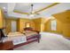Spacious bedroom with a ceiling fan and an unusual ceiling design at 2641 Loch Way, Snellville, GA 30039