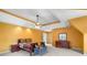 Spacious bedroom with a tray ceiling, ample closet space, and a connected sitting area at 2641 Loch Way, Snellville, GA 30039