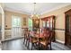 Elegant dining room with wainscoting, chandelier, and ample space for entertaining at 2641 Loch Way, Snellville, GA 30039
