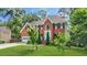 Charming two-story brick home with a well-kept lawn and mature trees in a desirable neighborhood at 2641 Loch Way, Snellville, GA 30039