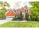 Beautiful two story brick home featuring a manicured lawn and an attached two-car garage at 2641 Loch Way, Snellville, GA 30039