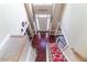 Grand foyer with hardwood floors, a staircase and a view of the entry door at 2641 Loch Way, Snellville, GA 30039
