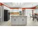 Spacious kitchen with a large island, granite countertops, and white cabinetry at 2641 Loch Way, Snellville, GA 30039