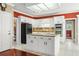 Well-appointed kitchen with granite counters, large island, and updated appliances at 2641 Loch Way, Snellville, GA 30039
