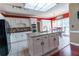 Modern kitchen with white cabinetry, an island, and granite countertops at 2641 Loch Way, Snellville, GA 30039