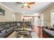 Open living area with hardwood floors, plush seating, and access to the kitchen at 2641 Loch Way, Snellville, GA 30039