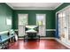 Spacious office showcasing hardwood floors, large windows, and serene green walls at 2641 Loch Way, Snellville, GA 30039