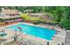 An outdoor community pool with a lifeguard stand, a clubhouse, and ample seating at 2641 Loch Way, Snellville, GA 30039