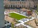 Modern backyard with a seating area, dining area, and artificial grass at 2660 Peachtree Nw Rd # 13H, Atlanta, GA 30305