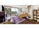Spacious bedroom with hardwood floors and expansive windows with a city view at 2660 Peachtree Nw Rd # 13H, Atlanta, GA 30305