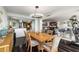 Open dining area with wood floors and large table for six at 2660 Peachtree Nw Rd # 13H, Atlanta, GA 30305
