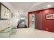 Bright hallway with a decorative sliding door and views to the outside from the end of the hall at 2660 Peachtree Nw Rd # 13H, Atlanta, GA 30305