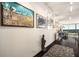 Bright hallway with hardwood floors, modern lighting, and artwork displayed on the walls at 2660 Peachtree Nw Rd # 13H, Atlanta, GA 30305