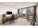Spacious office area with a sliding glass door to a balcony overlooking the city at 2660 Peachtree Nw Rd # 13H, Atlanta, GA 30305