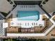 Aerial view of community pool surrounded by lounge chairs and seating areas at 2660 Peachtree Nw Rd # 13H, Atlanta, GA 30305