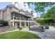 Beautiful backyard with a multi-level deck, outdoor seating, swimming pool, and lush landscaping at 5589 Forkwood Nw Dr, Acworth, GA 30101