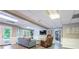 This finished basement features a couch, a chair, and a walkout to the pool at 5589 Forkwood Nw Dr, Acworth, GA 30101