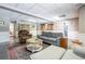 This is a finished basement with neutral paint, and a couch and chairs surrounding a coffee table at 5589 Forkwood Nw Dr, Acworth, GA 30101