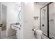 This bright bathroom has new tile, a black framed shower, and a vanity with a granite countertop at 5589 Forkwood Nw Dr, Acworth, GA 30101