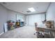 This basement bedroom has neutral paint, a desk and a closet with sliding doors at 5589 Forkwood Nw Dr, Acworth, GA 30101